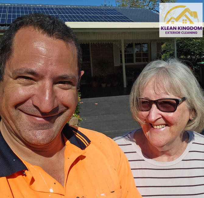 Klean Kingdom owner with satisfied customer after concrete roof restoration in Hebersham, Sydney using Dulux AcraTex